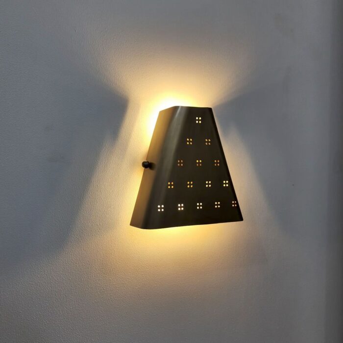Brass wall sconce Light with perforated pattern, warm ambient wall lighting fixture