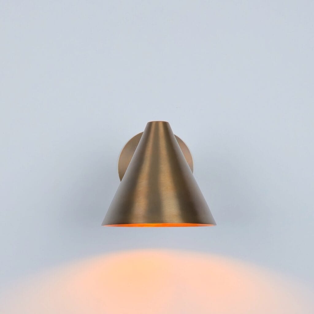 ​"Wall Sconce Light: A handmade brass cone wall lamp with a brushed finish, featuring a minimalist design perfect for modern or industrial interior decor."