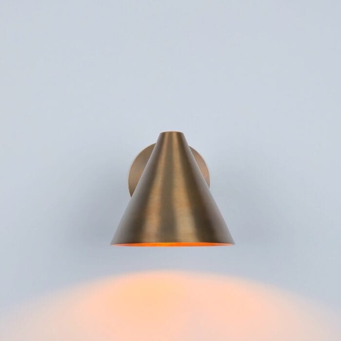 ​"Wall Sconce Light: A handmade brass cone wall lamp with a brushed finish, featuring a minimalist design perfect for modern or industrial interior decor."