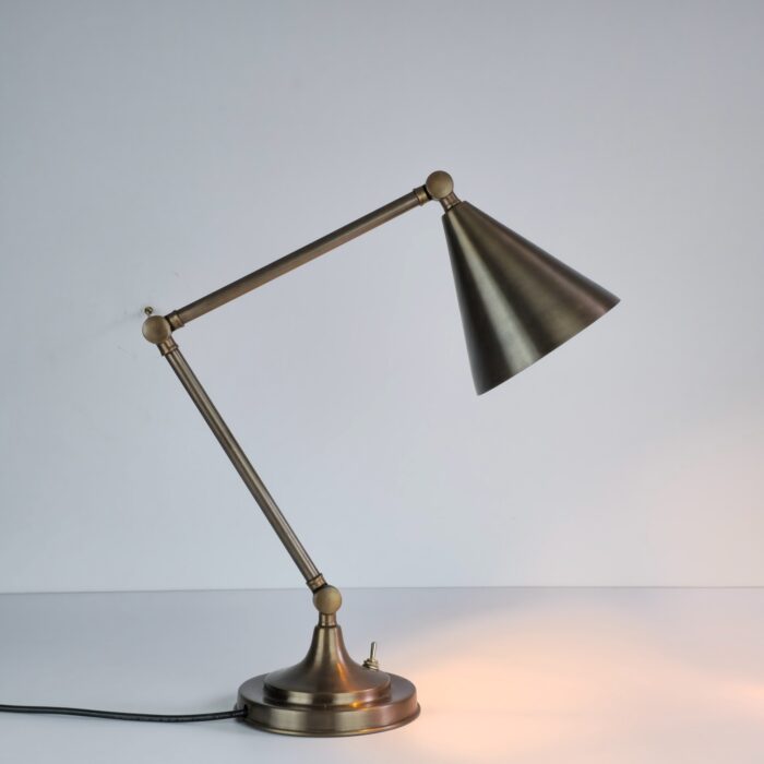 Handmade brass table lamp with adjustable arm and cone shade
