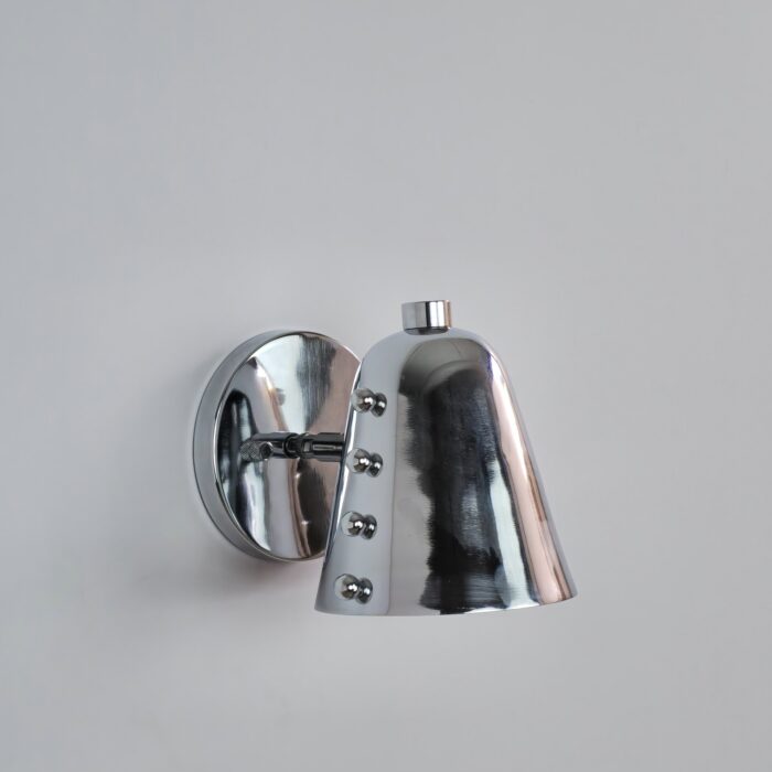 Modern chrome wall sconce featuring a cone-shaped metal shade with decorative side rivet details and an adjustable swivel arm on a round backplate.